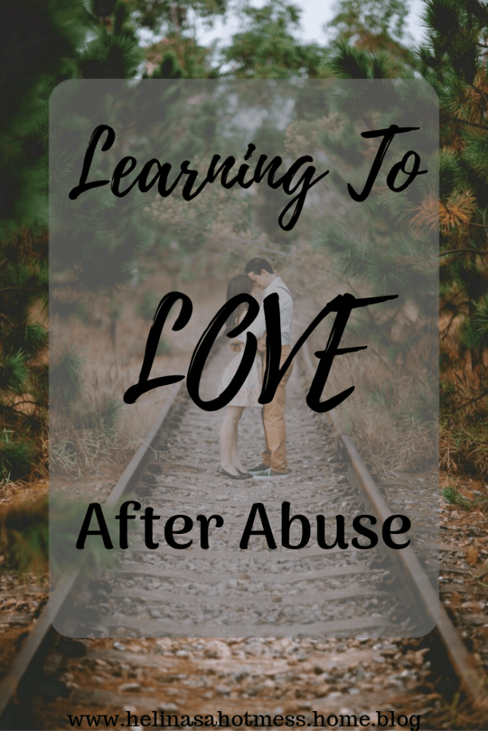 Young Couple on railroad tracks in woods