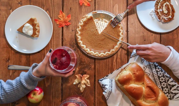 Pie on wooden table with bread