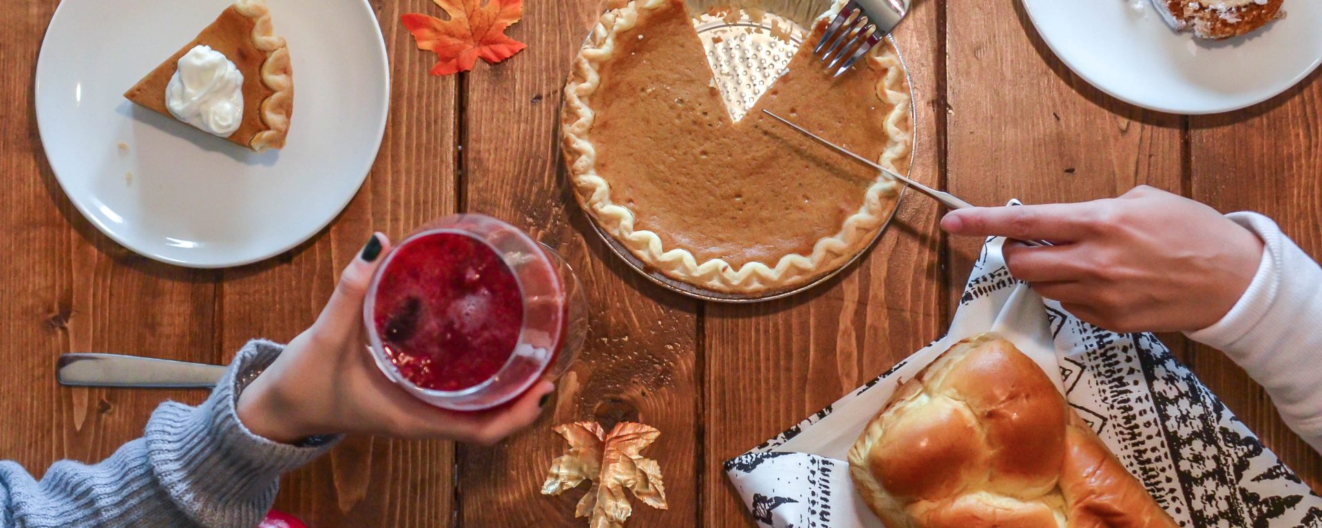 Pie on wooden table with bread