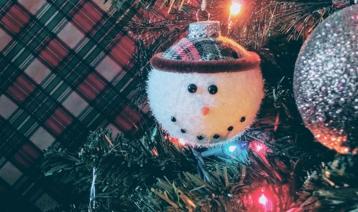 Snowman Face Ornament On Christmas Tree
