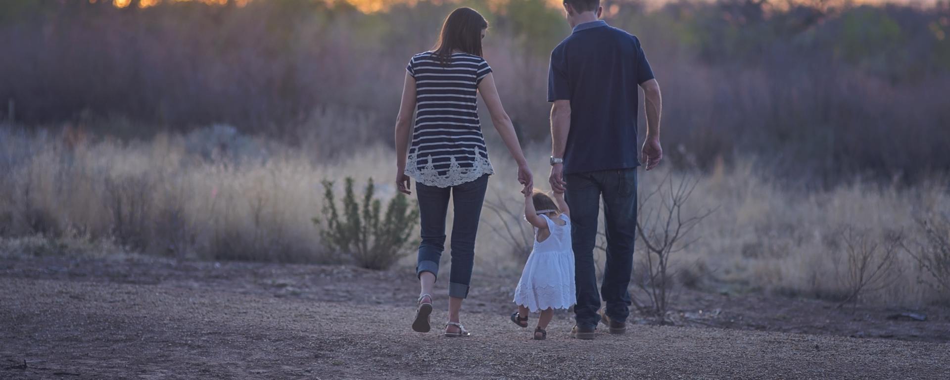 parents walking with child